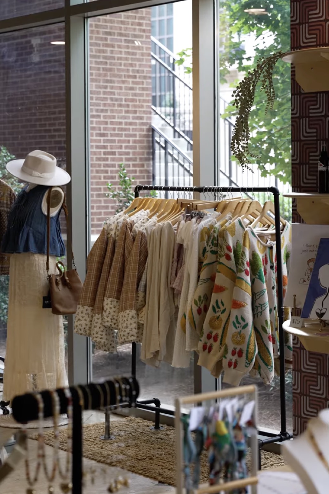Racks of clothing by the windows at House Of